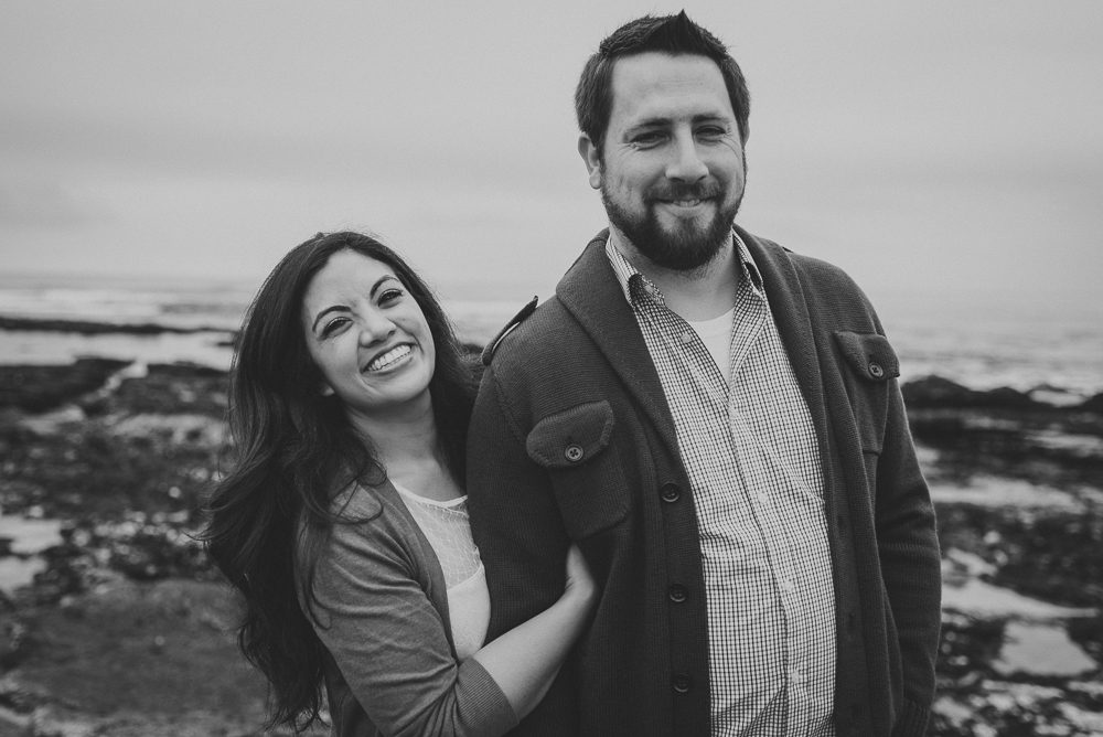 black and white of engagement photo at beach