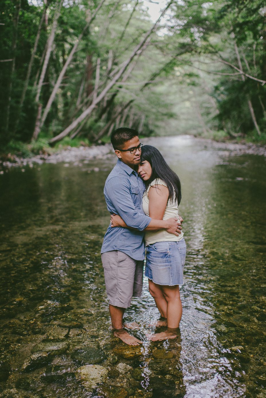 engagement photo in pfeiffer state park standing in river