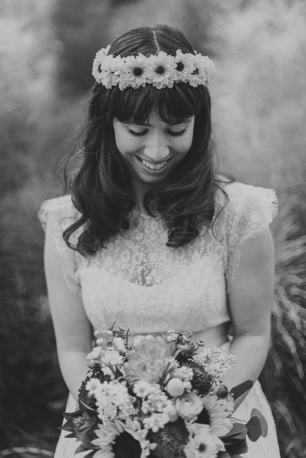 black and white of bride holding flowers