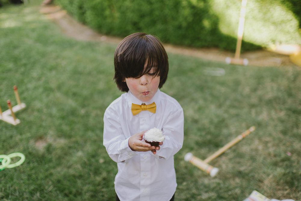 little boy with cupcake