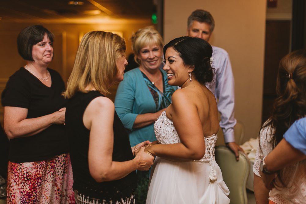 Bride greeting guests at wedding reception at Pardini's Catering in Fresno, California