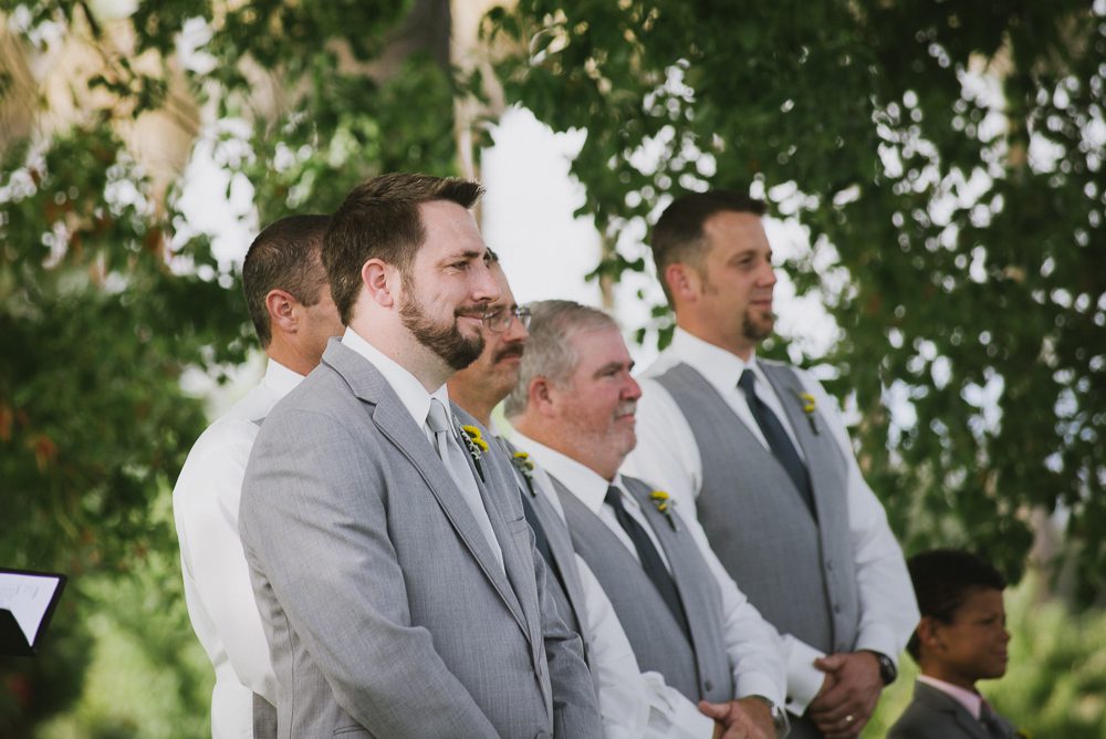 groom seeing bride walk down the aisle at Wedding Party at San Joaquin River Parkway Wedding
