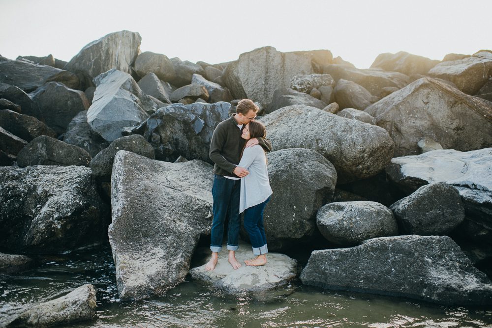 Couple hugging on rocks