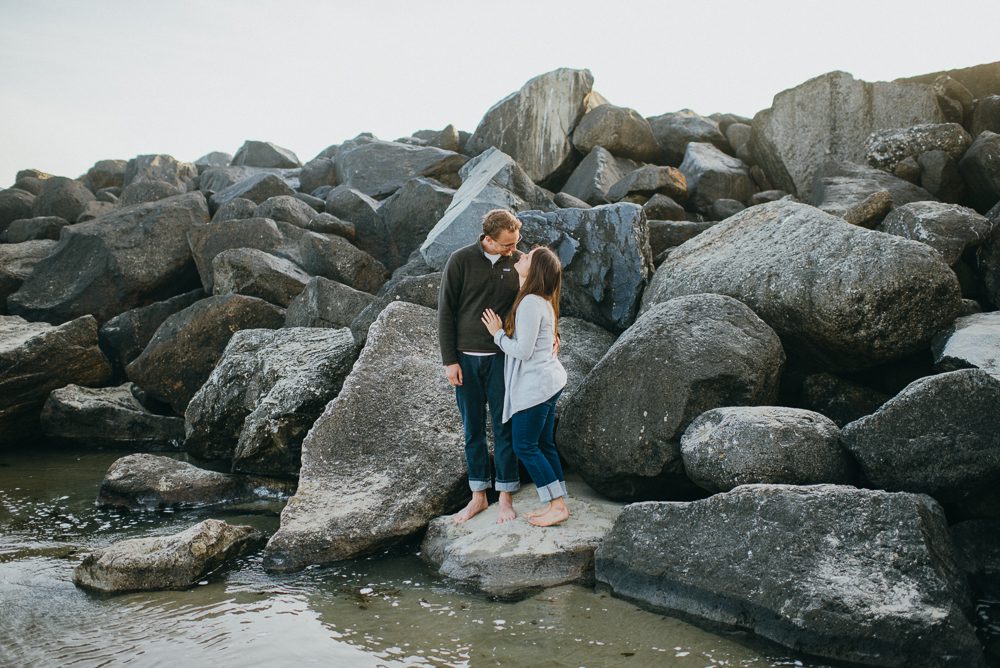Couple hugging on rocks