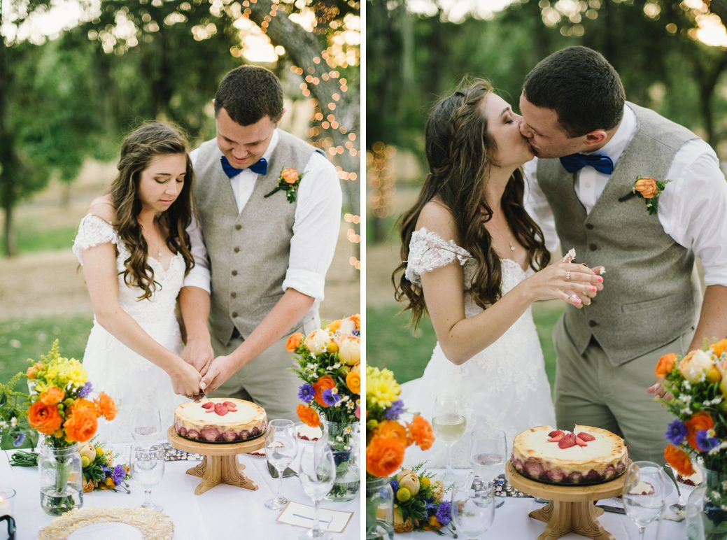 bride and groom cutting a cheesecake