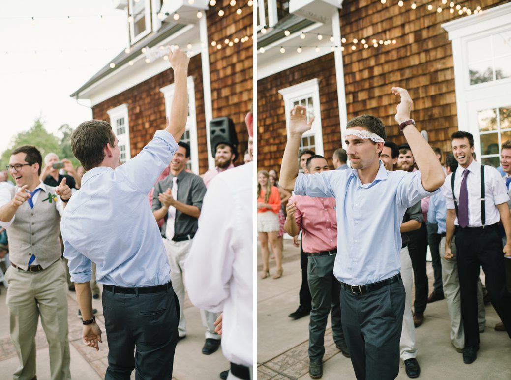 guy catching garter during wedding reception