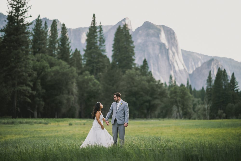 Bride and groom standing in yosemite valley