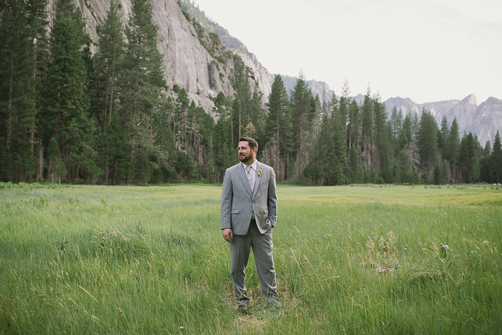 groom standing in Yosemite valley