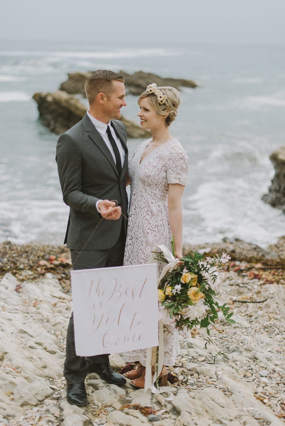 couple holding sign made by Rosey Calligraphy 