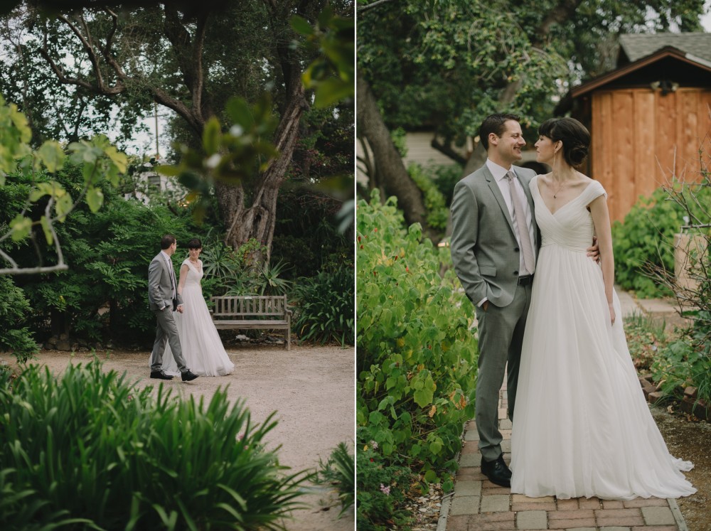 bride and groom walking through gardens