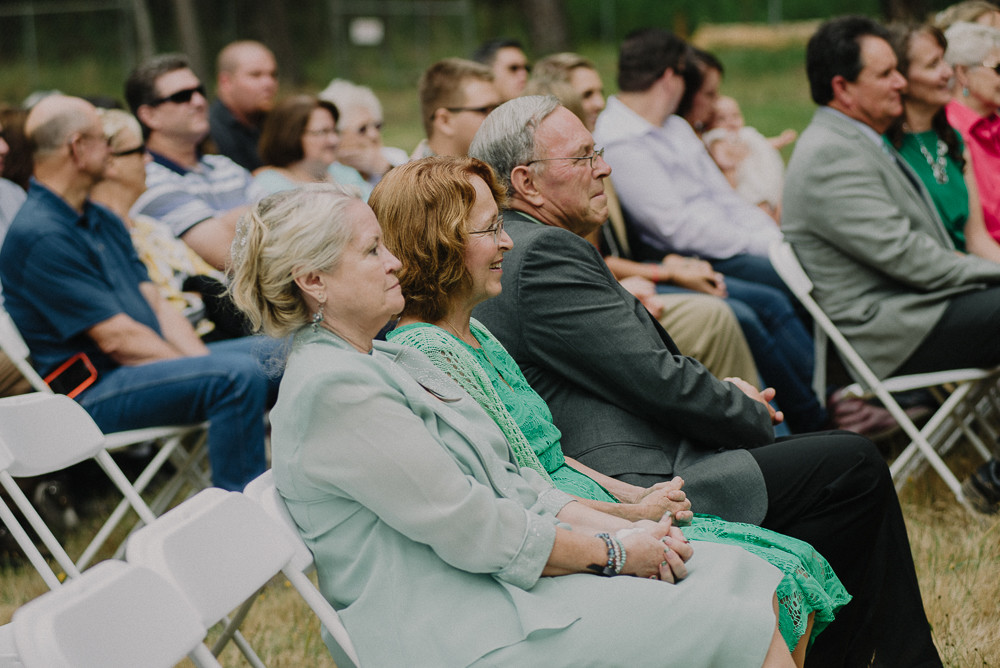 parents watching their son get married