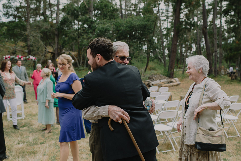 groom hugging grandpa after he got married
