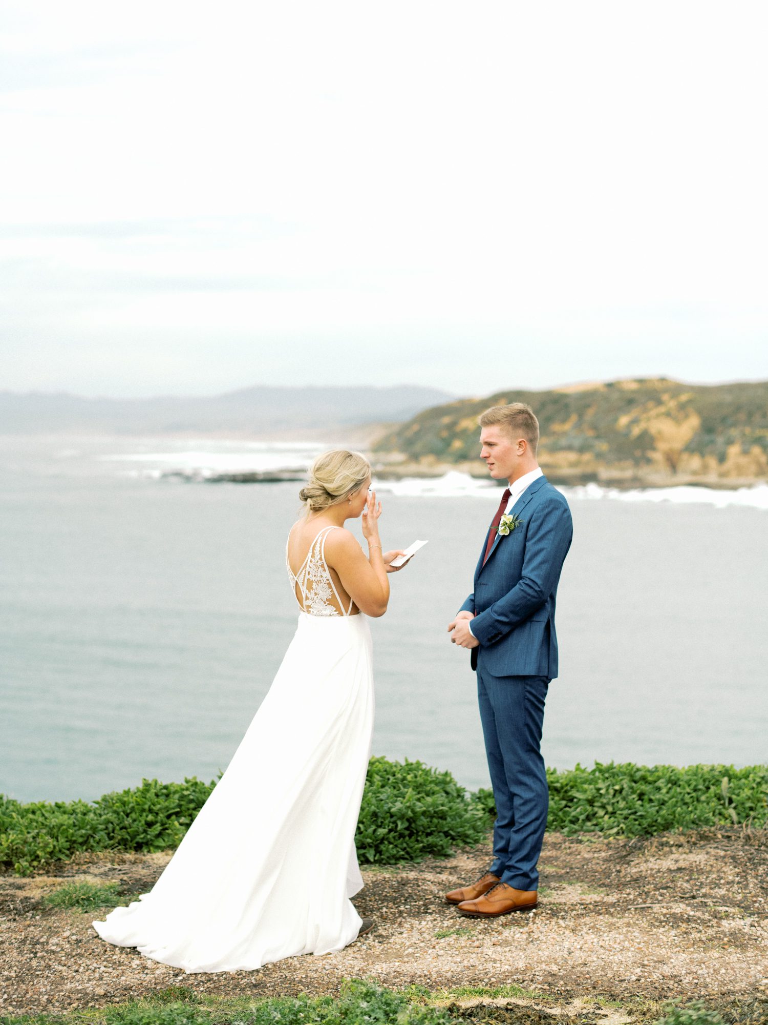 Bride reads her vows to her groom overlooking the Central Coast for a San Luis Obispo Elopement