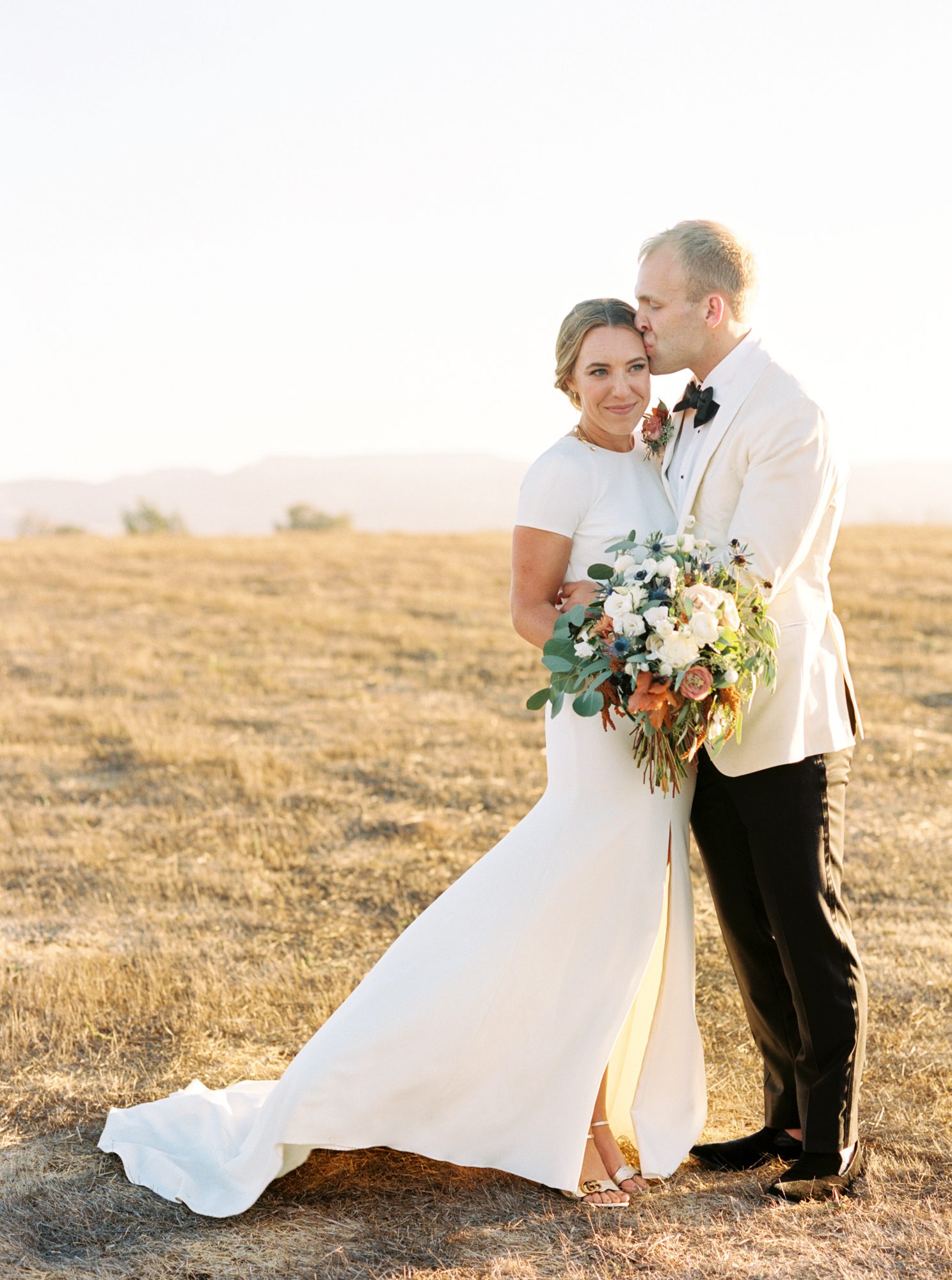 Sunset portraits at Flying Caballos Ranch by Loveridge Photography - Bride in Sarah Seven dress and groom is J Crew Suit