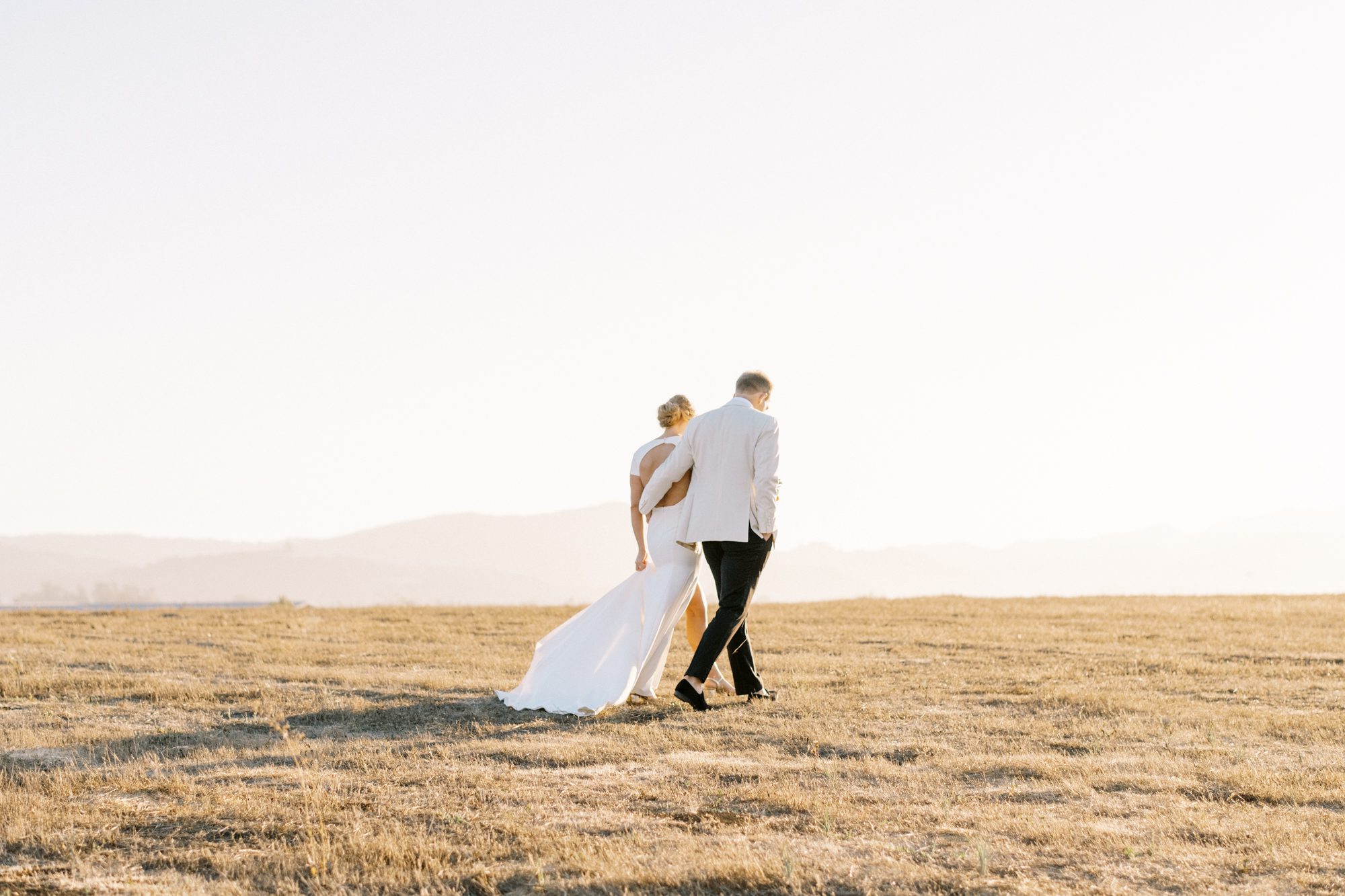 Sunset portraits at Flying Caballos Ranch by Loveridge Photography - Bride in Sarah Seven dress and groom is J Crew Suit